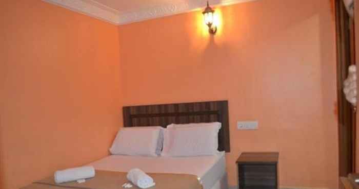 Kamar Tidur Mines Times Inn Hotel