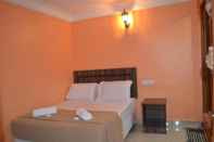 Kamar Tidur Mines Times Inn Hotel