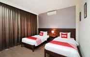 Kamar Tidur 5 OYO 557 Tong House Resort