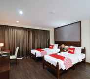 Kamar Tidur 7 OYO 557 Tong House Resort