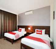 Kamar Tidur 3 OYO 557 Tong House Resort