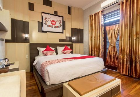 Kamar Tidur OYO 619 Naufal Guest House Syariah