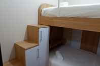 Kamar Tidur Relax & Comfy 2BR Apartment at Puri Mas