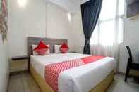 Kamar Tidur SUPER OYO 251 The Maximus Inn Hotel