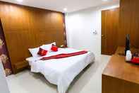 Kamar Tidur White Ville Apartment