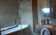 In-room Bathroom 5 Strategic Room at The Windsor Apartment Near Lippo Puri and Puri Indah Mall