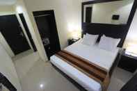 Kamar Tidur Kuta Airport Insta Hotel