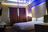 ห้องนอน Octo Hotel Cirebon