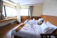 ห้องนอน Hotel United Mandalay