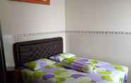 ห้องนอน 5 Alifiana Homestay - 3 Bedrooms