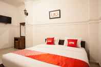 Kamar Tidur OYO 1084 Hotel Cirasa Syariah