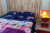 Phòng ngủ Adil Jaya Homestay