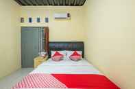 Kamar Tidur OYO 1120 Hotel Grand Liquid