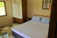 Kamar Tidur Ayoyo Cove Inn Guesthouse