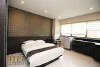 Bedroom JJH Serviced Apartments