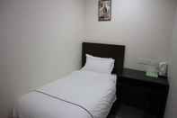 Kamar Tidur DCozy Hotel