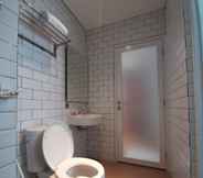 Phòng tắm bên trong 7 Merlyns Garden Inn Syariah