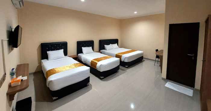 Bedroom Harmony Inn Belitung - City Hotel