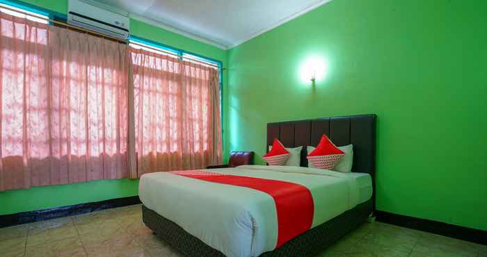 Kamar Tidur Super OYO 1389 Hotel Carissima