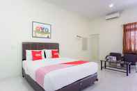 ห้องนอน OYO 1569 Kupula Residence