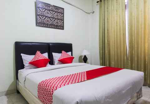 Kamar Tidur Super OYO 1682 Greenia Hotel