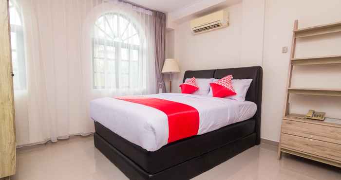 Kamar Tidur OYO 1771 Zeke Hotel