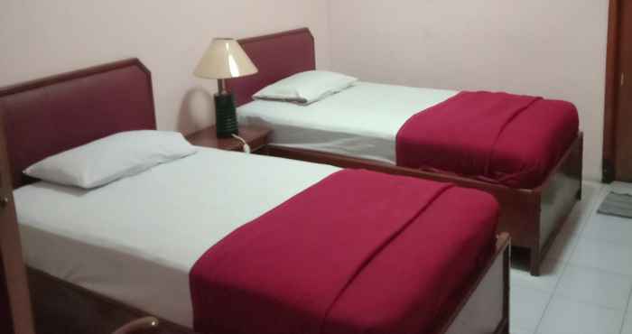 Bedroom OYO 1751 Hotel Trihadhi