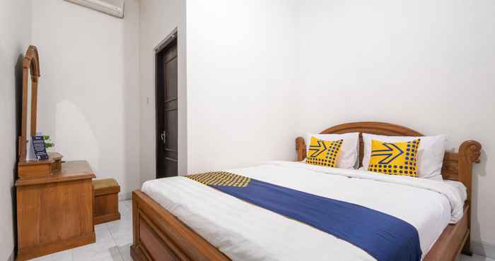 Kamar Tidur OYO 1806 Puri Arsita Homestay