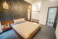 Kamar Tidur The Garden Hotel and Apartment