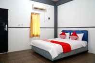 Kamar Tidur OYO 1861 Martha Guest House