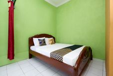 침실 SPOT ON 2106 Homestay Flamboyan