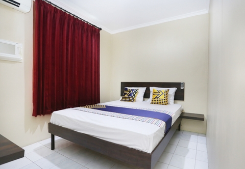 Bedroom SPOT ON 2358 Aster Homestay