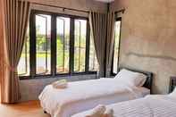 ห้องนอน Baan Kampu Resort