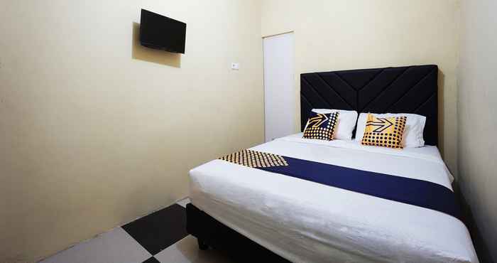 Kamar Tidur SPOT ON 2530 Tiga Mas Inn