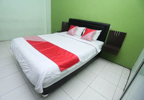 Bedroom OYO 2524 Royal Borneo Guesthouse
