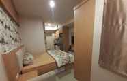 Bedroom 2 Apartemen Grand Kamala Lagoon Cozy by Bonzela Property