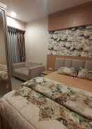 BEDROOM Apartemen Grand Kamala Lagoon Cozy by Bonzela Property