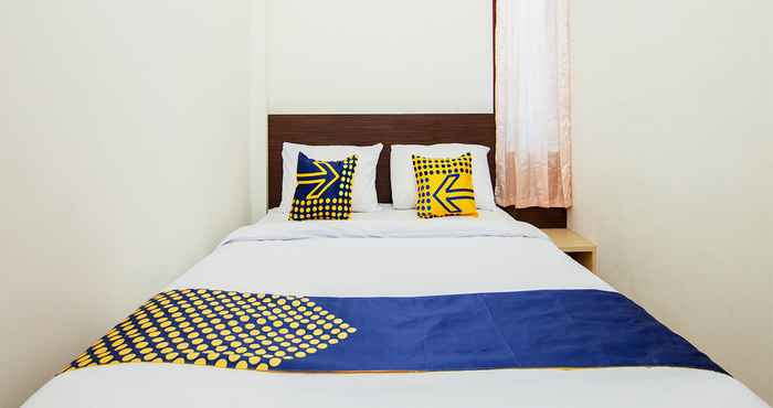 Kamar Tidur SPOT ON 2220 Pink's Guest House