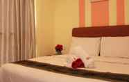 Kamar Tidur 4 Sun Inns Hotel Meru Raya