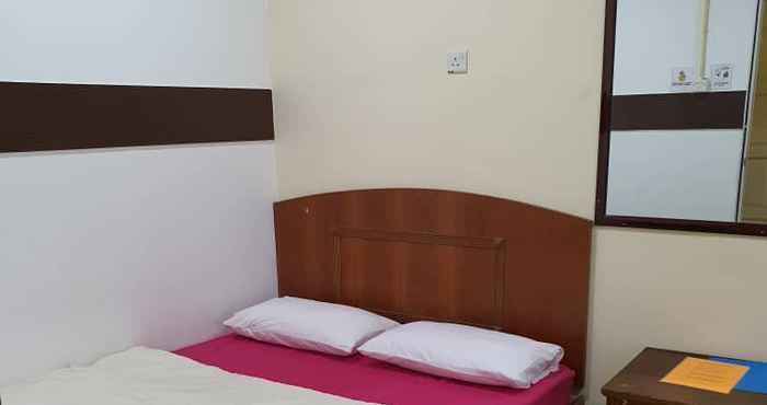 Bedroom OYO 89784 Impiana Hotel