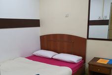 Bedroom OYO 89784 Impiana Hotel