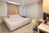 Kamar Tidur AT Home Hotel