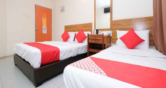 Kamar Tidur OYO 89877 Sun Triang Hotel