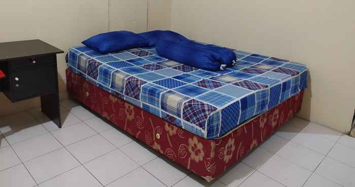 ห้องนอน OYO 3116 Batu Putih Homestay