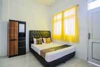 Bedroom SPOT ON 2780 Rumah Tamu Ei Guest House Syariah