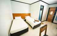 Kamar Tidur 2 Mahogany Tourist Inn