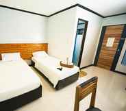 Kamar Tidur 2 Mahogany Tourist Inn