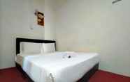 Bedroom 2 SPOT ON 89994 Rz Gold Hotel