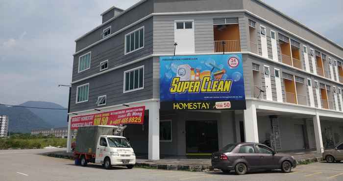 Bangunan SUPER OYO 90054 Summer Inn