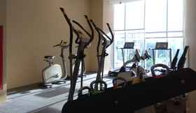 Fitness Center 6 Warm 3BR Apartment at Ambassade Residences By Travelio